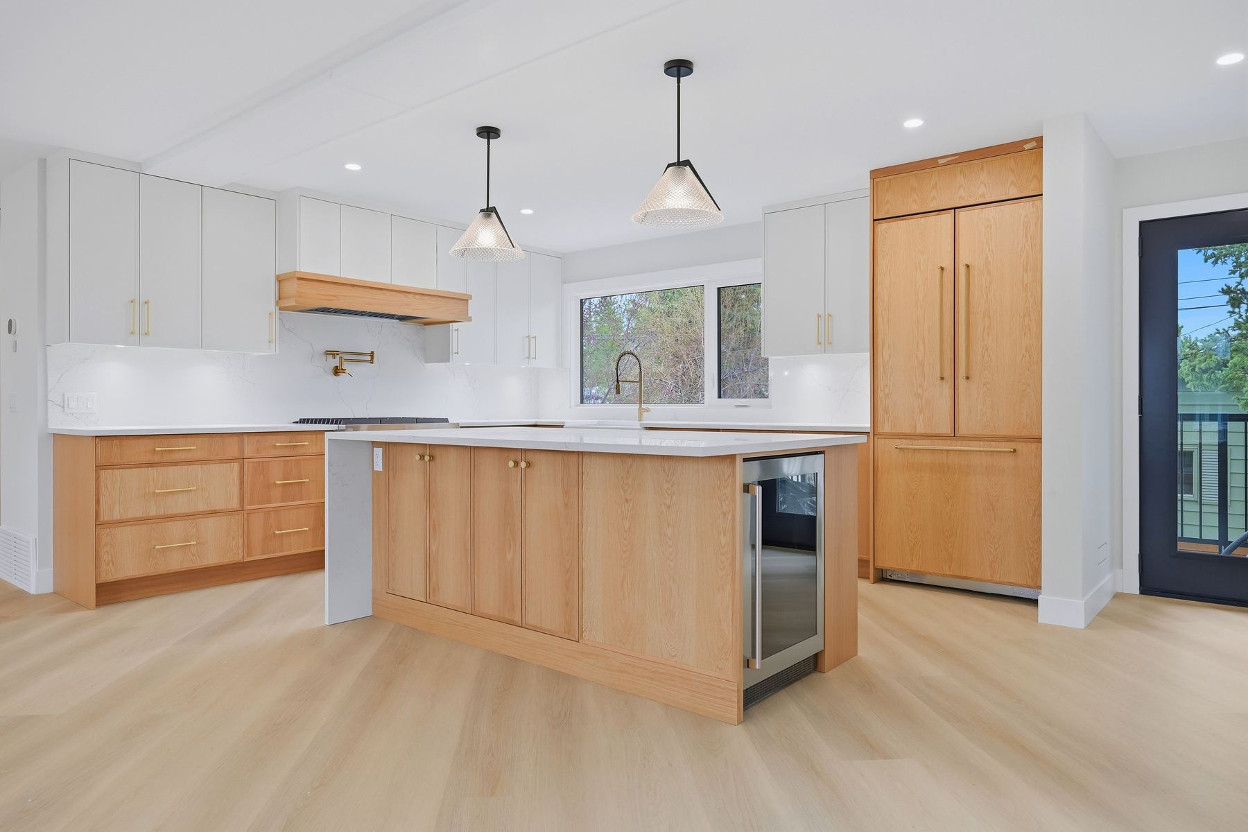 Kitchen — wide view to the entry