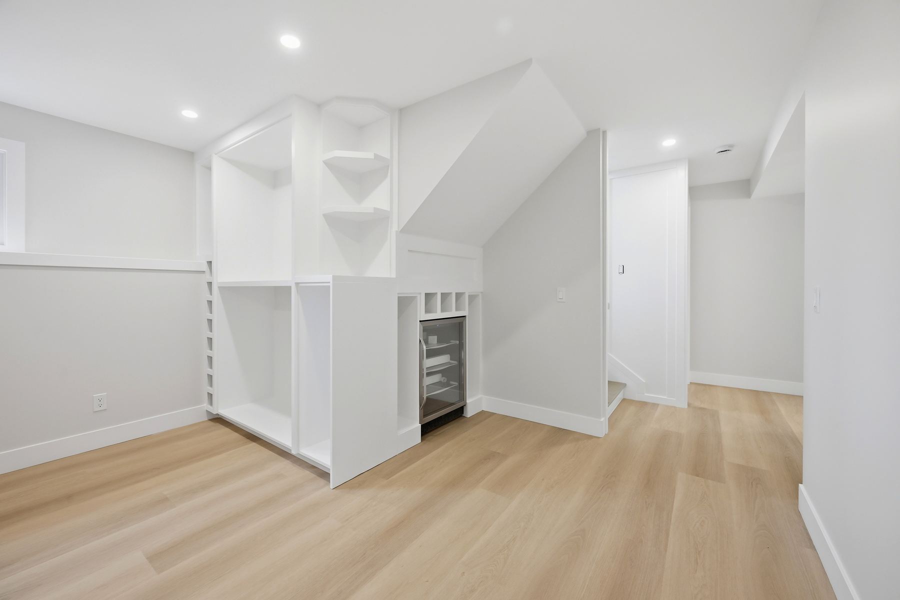 Recreation room — built-in shelving and beverage area