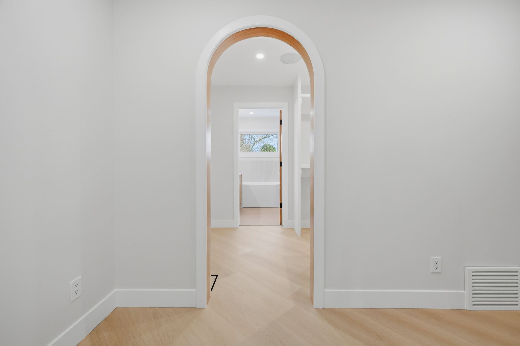 White-oak archway between bedroom and ensuite